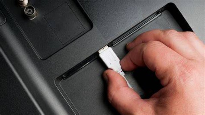 How can I play movies from my phone to my TV using USB?