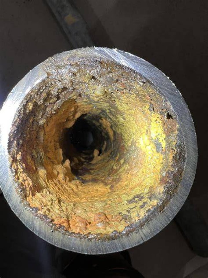 How do you clean old galvanized drain pipes?