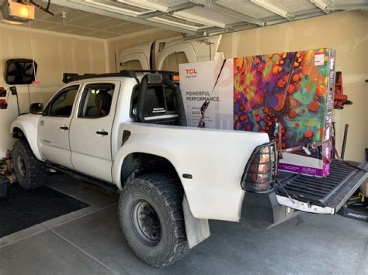 How do you transport a TV in a truck bed?