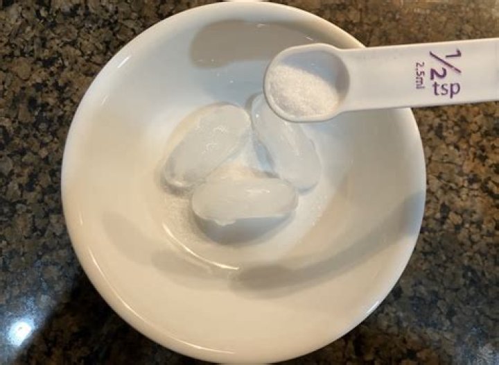 What melts ice faster salt or sand?