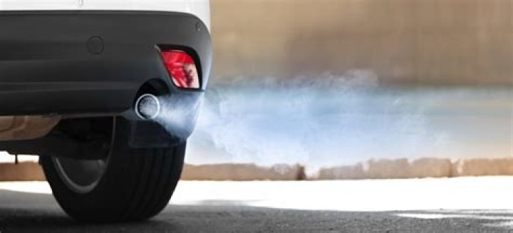 Why is my car blowing blue smoke when I accelerate?
